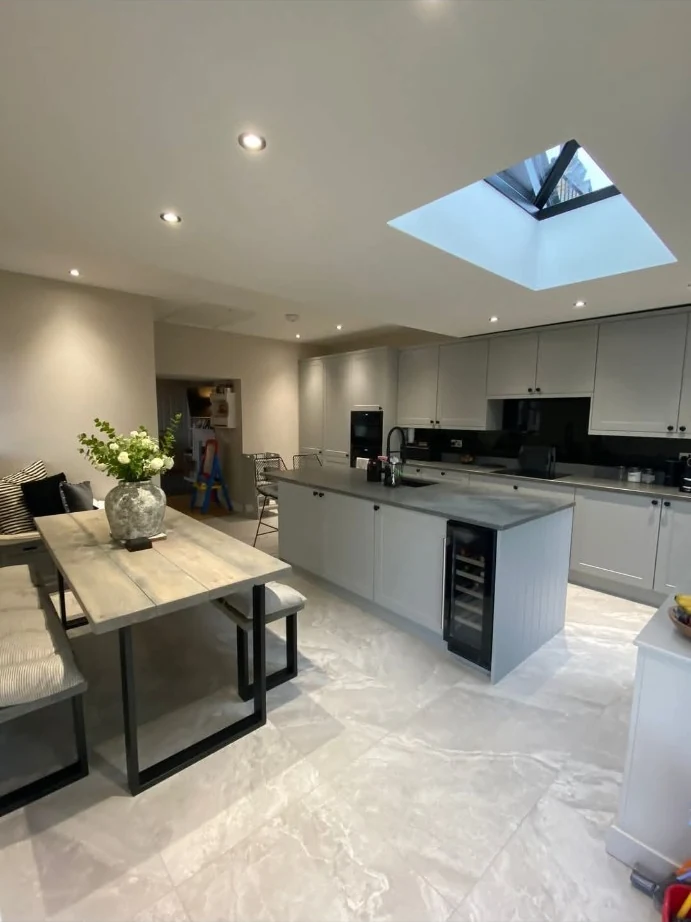 Open-plan kitchen with a central island and rooflight